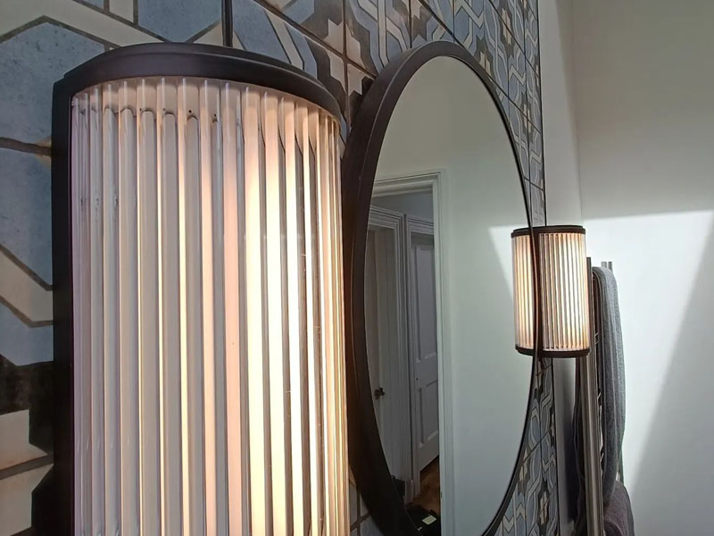 Art deco light installation within a bathroom by DX Electrical