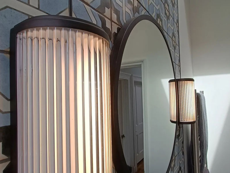 Art deco light installation within a bathroom by DX Electrical