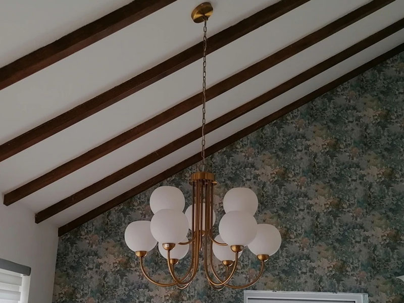 Pendant light hangning from pitched ceiling