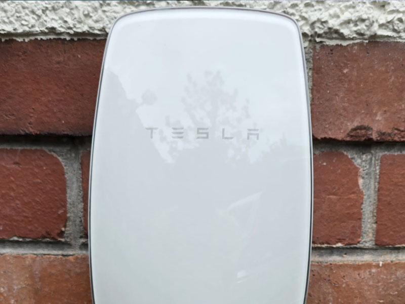 Tesla charger installation on brickwall by DX Electrical
